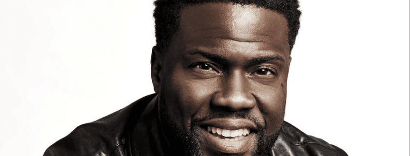 Smiling man in a leather jacket.